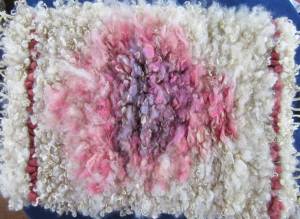 shows fleece rug with pink and purple in center