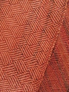 shows the diamond pattern of plaited twill