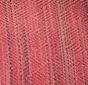 weaving with coral variegated warp, pattern not really visible
