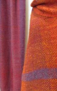 purple shawl hanging on left, with orange one wrapped on the right